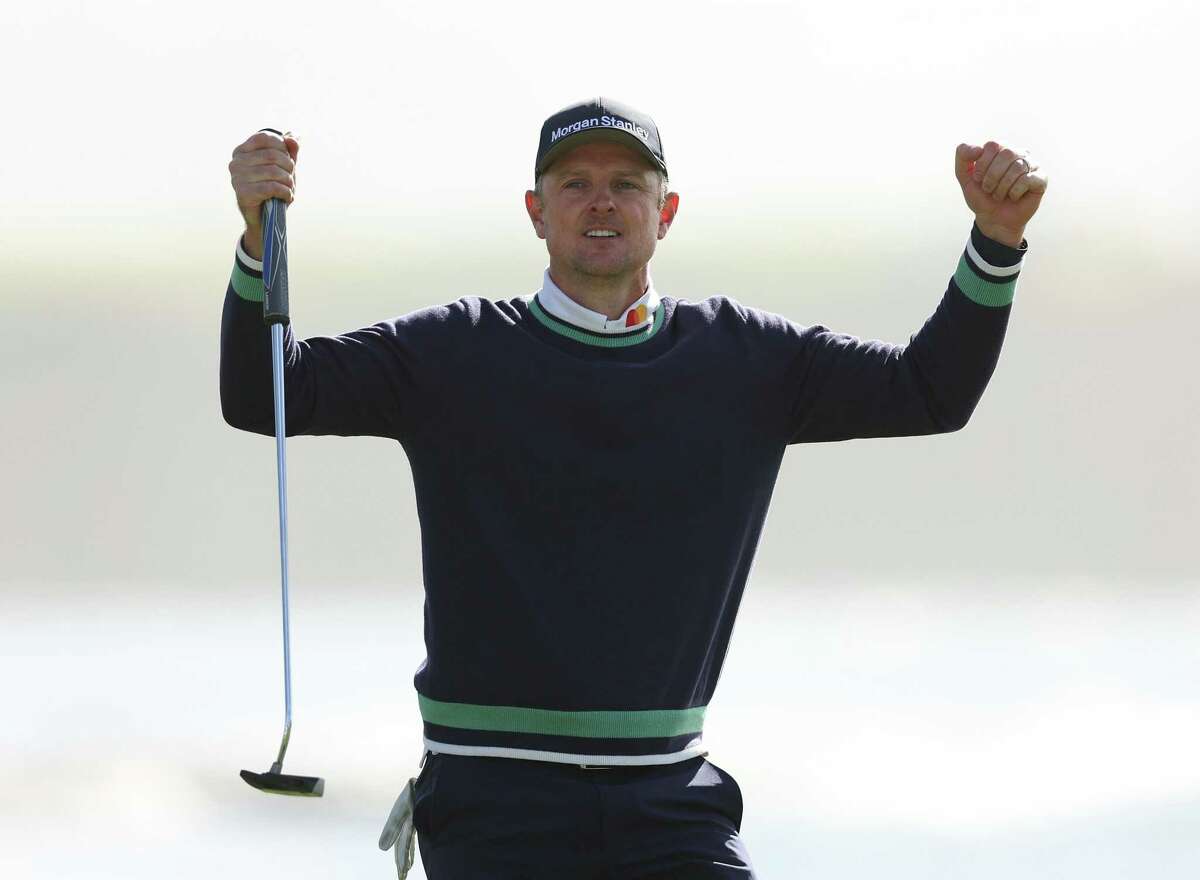 PEBBLE BEACH, CALIFORNIA - FEBRUARY 06: Justin Rose of England celebrate his final putt for victory during the continuation of the final round of the AT&T Pebble Beach Pro-Am at Pebble Beach Golf Links on February 06, 2023 in Pebble Beach, California. (Photo by Ezra Shaw/Getty Images)