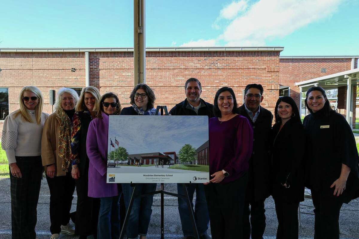 Spring Branch ISD officials show off an artist's rendering of the new Woodview Elementary School.