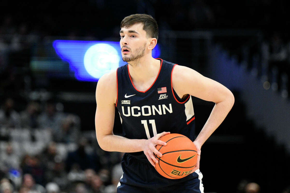 Connecticut forward Alex Karaban (11) in action during the first half of an NCAA college basketball game against Georgetown, Saturday, Feb. 4, 2023, in Washington. (AP Photo/Nick Wass)