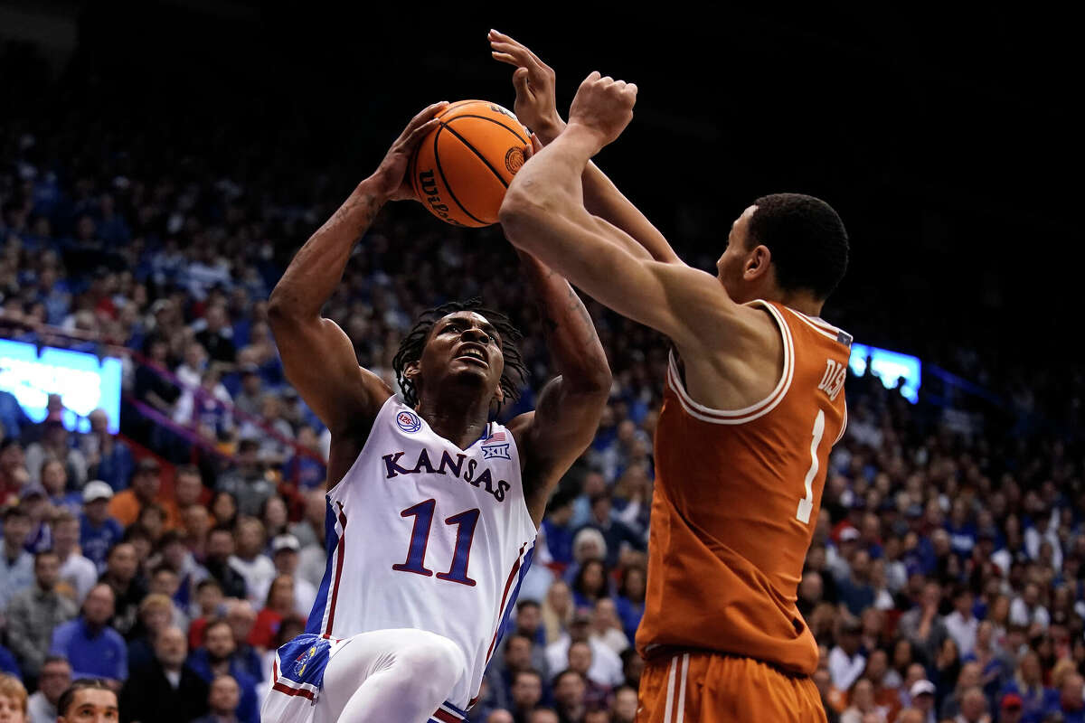 Forward Dylan Disu (1) and No. 5 Texas fought the good fight against No. 9 Kansas and guard MJ Rice on Monday night before falling to 12-37 in the all-time series.