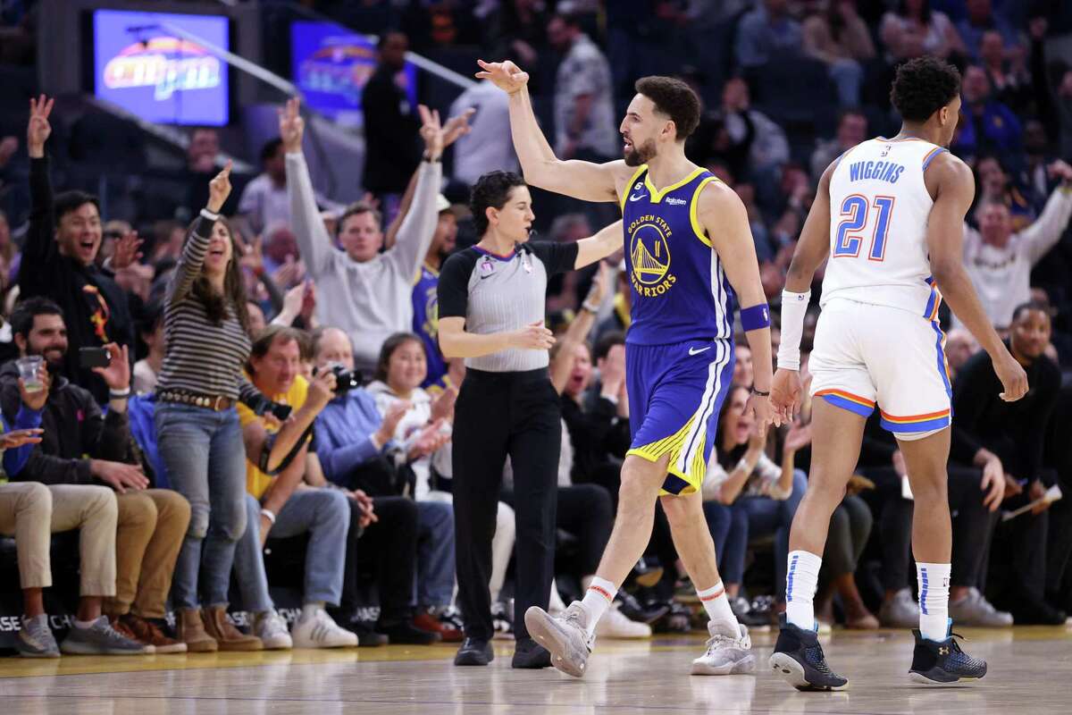 Golden State Warriors’ Klay Thompson celebrates 3 of his 27 1st half points against Oklahoma City Thunder during NBA game at Chase Center in San Francisco, Calif., on Monday, February 6, 2023.