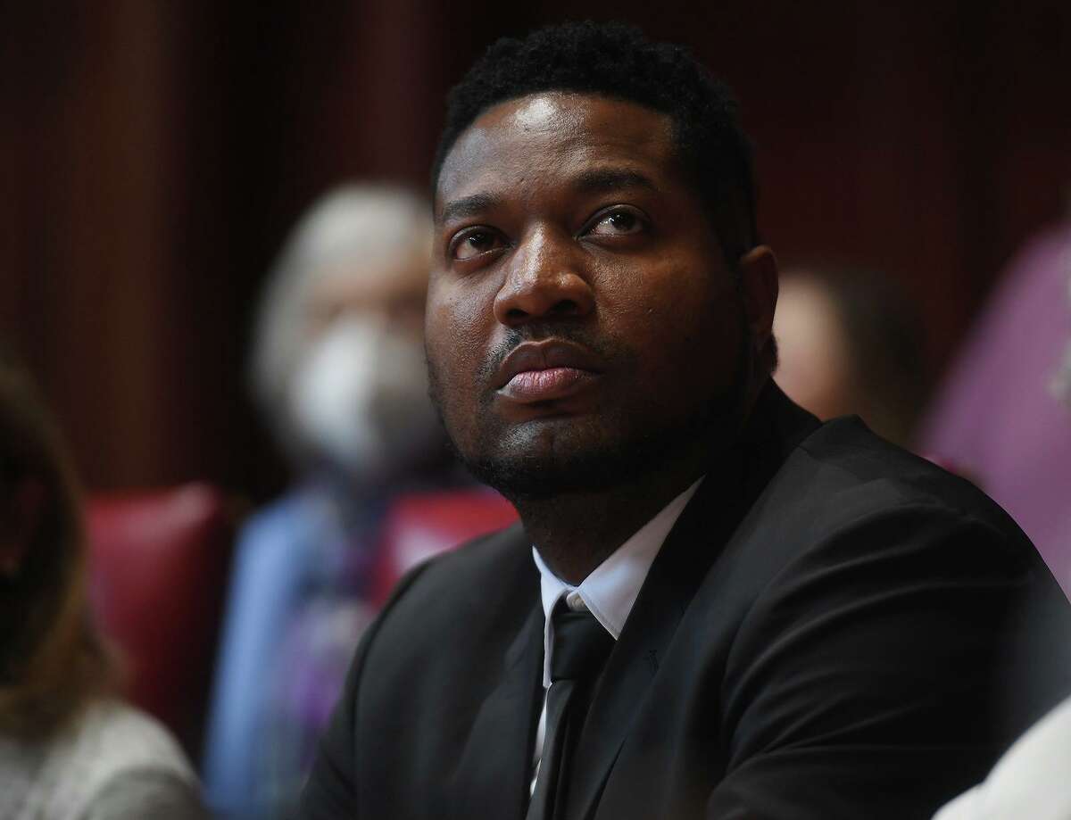 Newly elected state Sen. Herron Gaston, D-Bridgeport, attends the opening legislative session at the Capitol in Hartford, Conn. on Wednesday, Jan. 4.