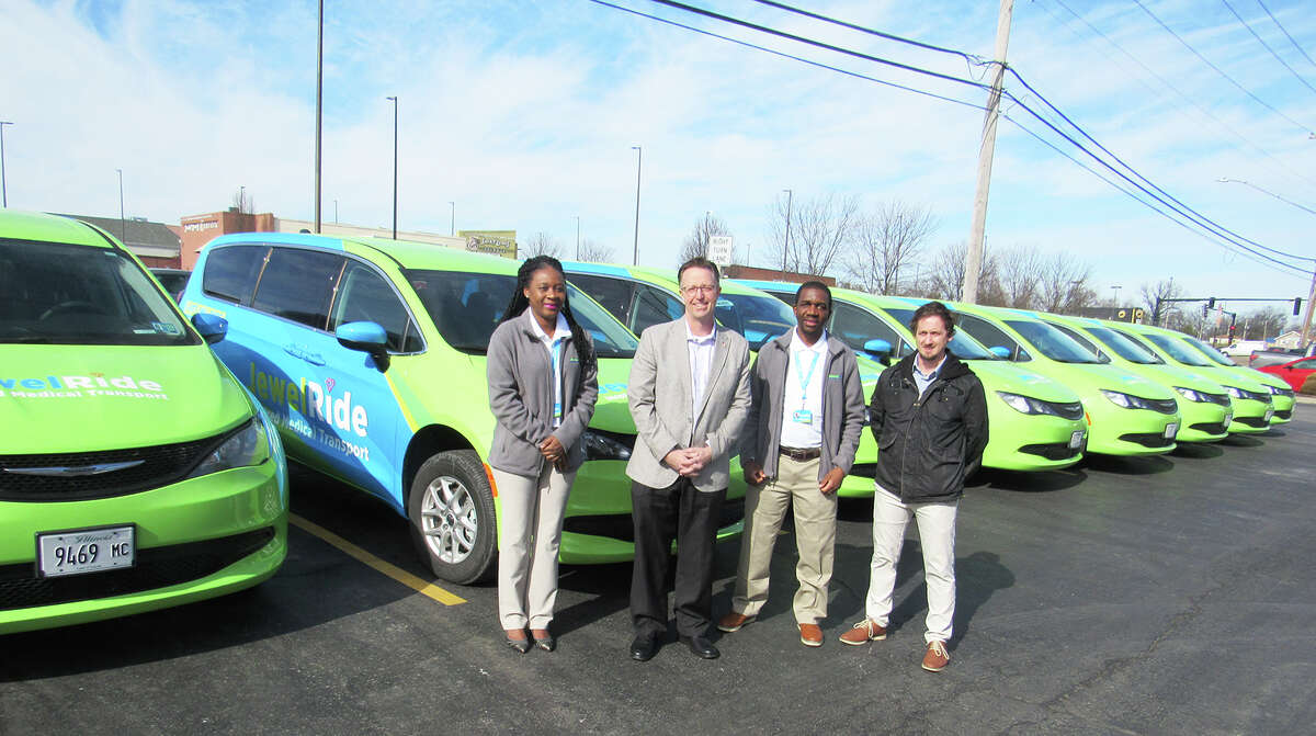 JewelRide recently added 10 new wheelchair accessible medically compliant vans to its fleet. Pictured from left are JewelRide co-founder Dr. Rutendo Nkomo, Edwardsville Mayor Art Risavy, JewelRide co-founder and CEO Tapiwa Mupereki and Edwardsville Economic and Community Developer James Arnold. 