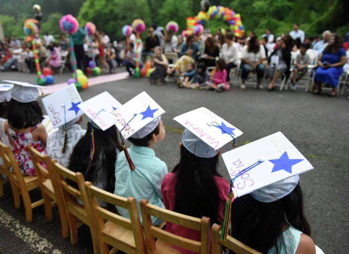 Children attend a Head Start preschool graduation ceremony in 2019.