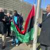 City and local officials gather at the Norwalk Heritage Wall to raise the Pan-African flag in honor of Black History Month on Feb. 7, 2023. 