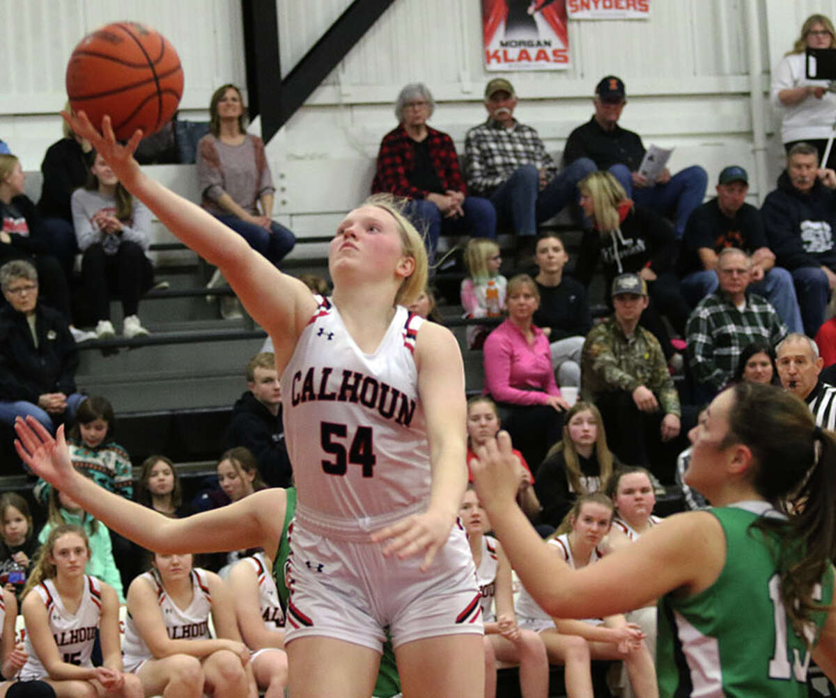 Calhoun's Audrey Gilman (54) goes in for two of her game-high 19 points against Carrollton on Monday night at Ringhausen Gym in Hardin.