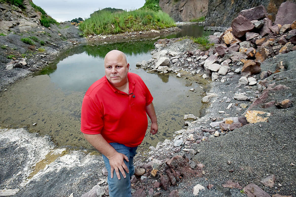 John Patton is photographed at the Farm River Rock quarry July 26, 2017, in East Haven.
