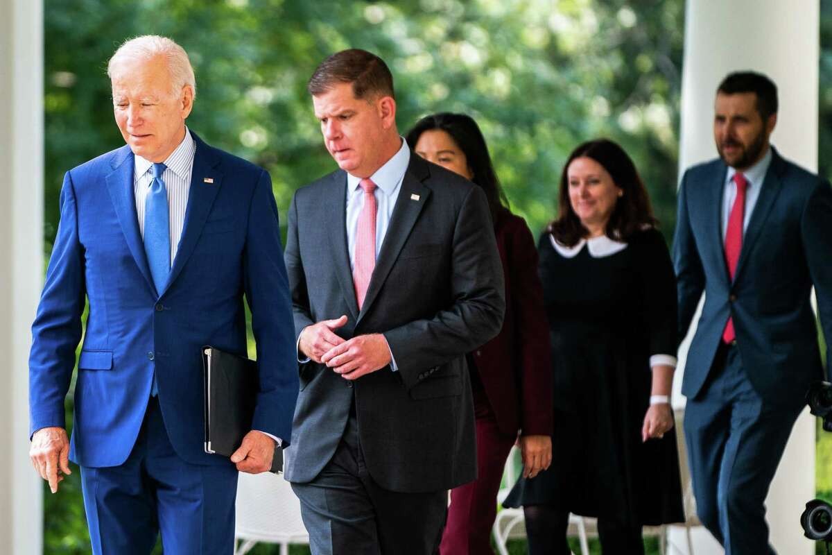 U.S. President Biden with United States Secretary of Labor Marty Walsh, United States Deputy Secretary of Labor Julie Su, and Made in America Director at the Office of Management and Budget Celeste Drake and National Economic Council director Brian Deese exits the Oval Office for remarks in the Rose Garden of the White House on Sept. 15.