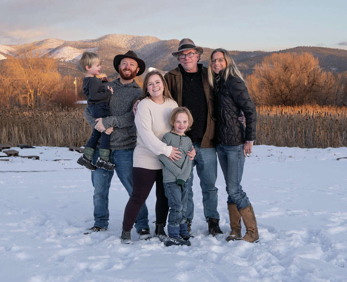 Blackburn is seen here with his family, from left to right, grandson Oliver, son Sam, daughter-in-law Scotney, grandson Archer, Jeff Blackburn, and partner Jessy Tyler.