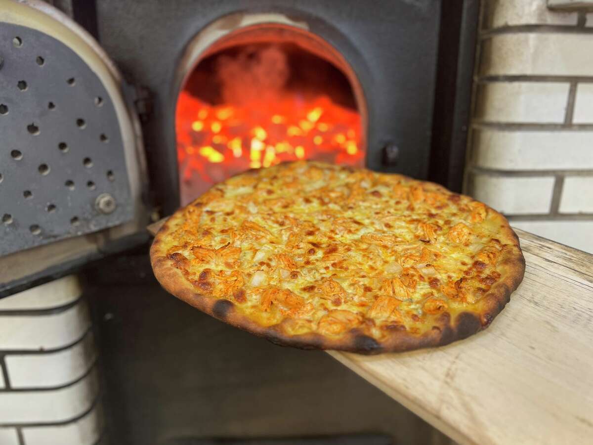 The chicken diavolo pizza features oven-roasted chicken coated in hot sauce, with white onion, Gorgonzola, mozzarella and Pecorino Romano.