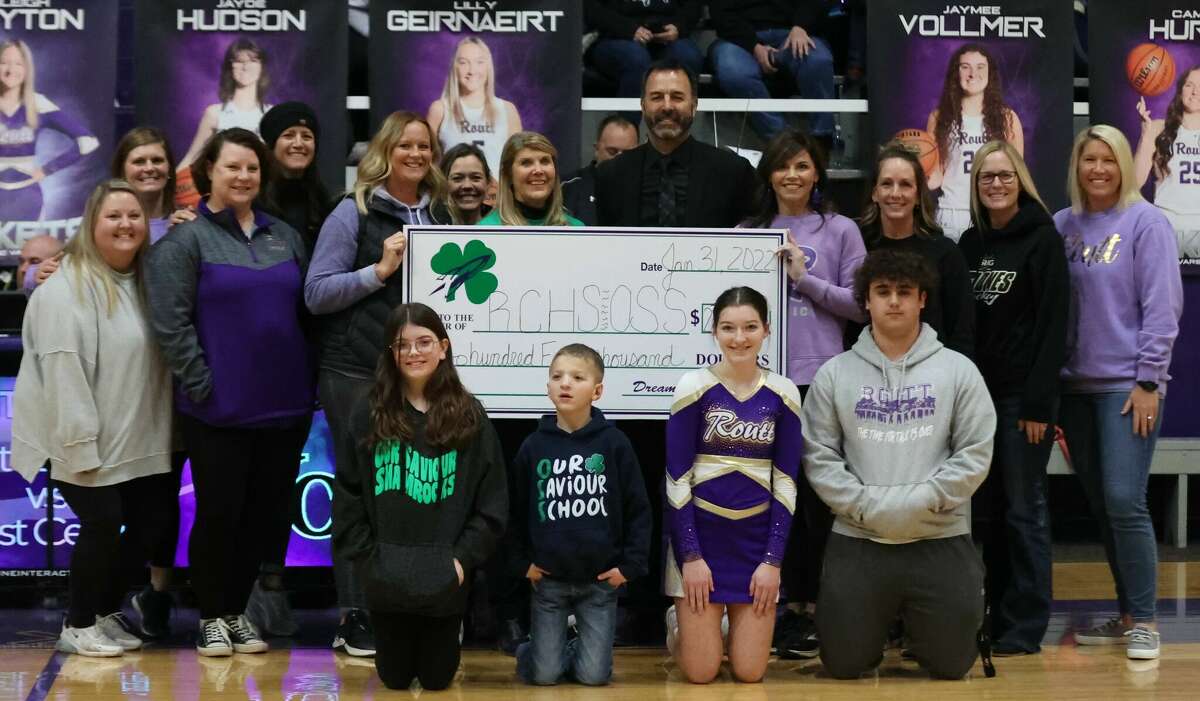 A record-breaking sale of 2022 Routt/Our Saviour Dreams Campaign tickets translated into a $125,000 gift for Routt Catholic High School and Our Saviour School. Shown at the check presentation are, front row, Sloan Wehrle, Walker Dyche, Kendall Little, and Aiden Meyer; back row, Maggie Peterson, Amy White, Becky McClellan, Val Creviston, Stacy Bradshaw, Jo Horabik, Stevie VanDeVelde, Dan Carie, Monica Eoff, Lindsay English, Angela Davis, and Mandy Leib.