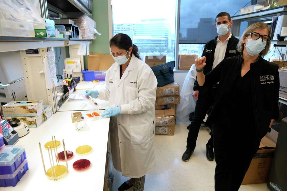 Pranoti Sahasrabhojane, clinical studies supervisor, left, Nadim Ajami, executive director of Scientific Research, and Jennifer Wargo, professor of Surgical Oncology and Genomic Medicine, and the leader of the Platform for Innovative Microbiome and Translational Research, are shown in the lab at the MD Anderson South Campus Research Building Tuesday, Feb. 7, 2023, in Houston.