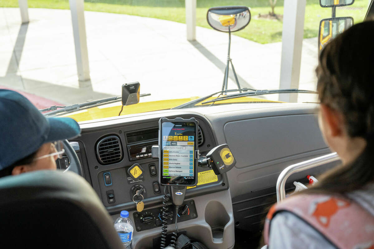 A Klein ISD bus driver and student use the SMART tag system. 