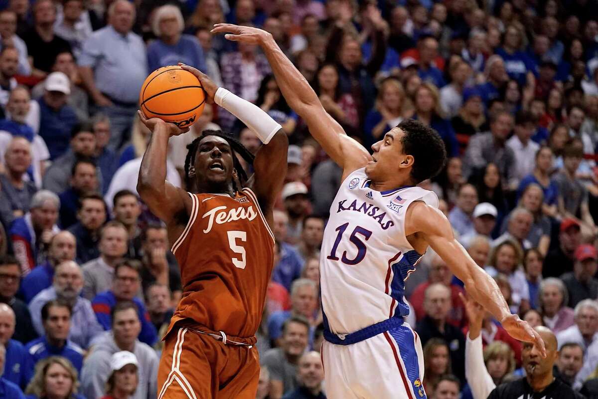 Texas guard Marcus Carr, left, said the Longhorns weren’t satisfied with a split this week in Kansas.