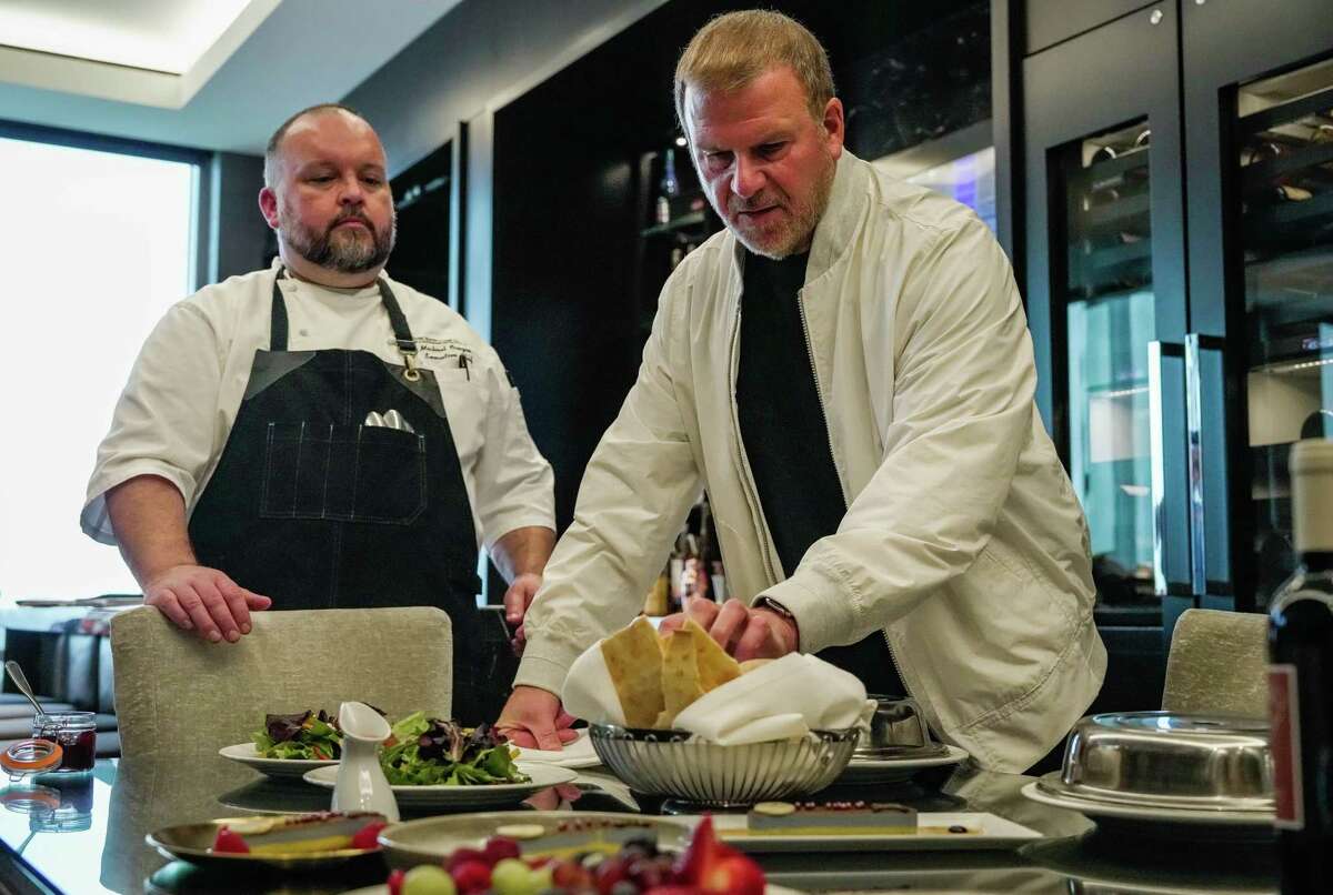 Tilman Fertitta discusses food presentation with Chef, Mike Orozco and other members of his executive hospitality team to discuss their upcoming infamous Mardi Gras party hosted on Galveston Island on Tuesday, Feb. 7, 2023 in Houston, TX.