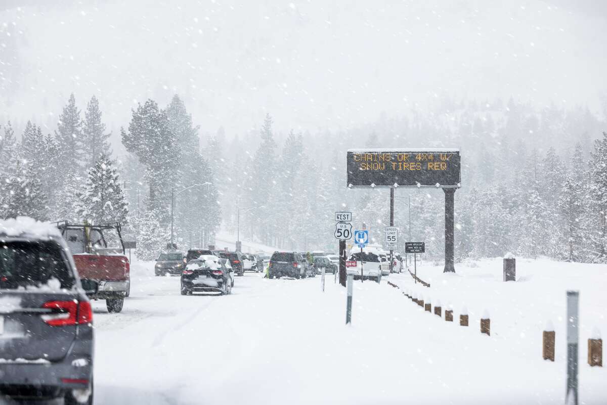 Cars pull over to apply chains before crossing Echo Summit near Lake Tahoe.