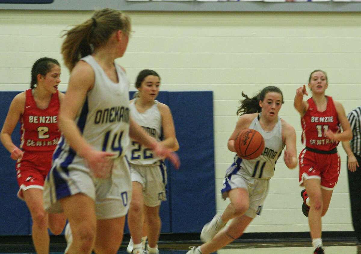 Onekama freshman Hailey Hart (11) pushes the ball up the floor against Benzie Central on Feb. 7, 2023 at Onekama Consolidated Schools. 
