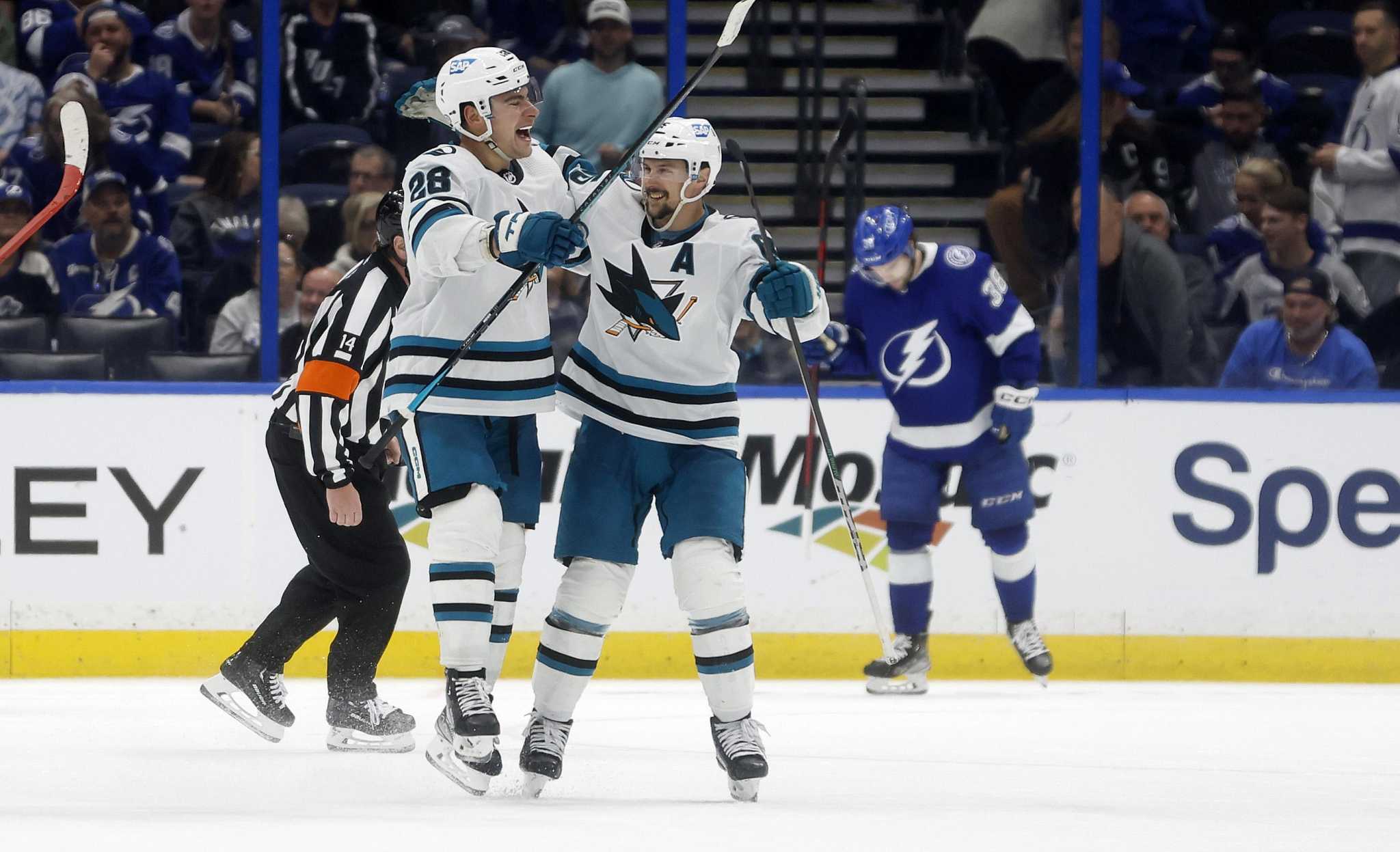 Tampa Bay Lightning center Michael Eyssimont (23) battles for the