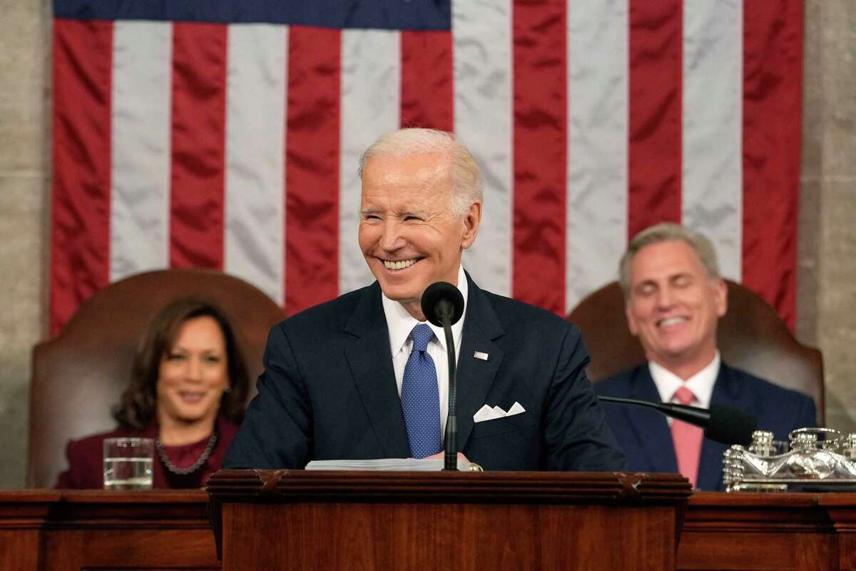 Vice President Kamala Harris, left, and Speaker of the House Kevin McCarthy (R-CA), right, listen as President Joe Biden delivers the State of the Union address in the House Chamber of the U.S. Capitol in Washington, D.C., on February 7, 2023.