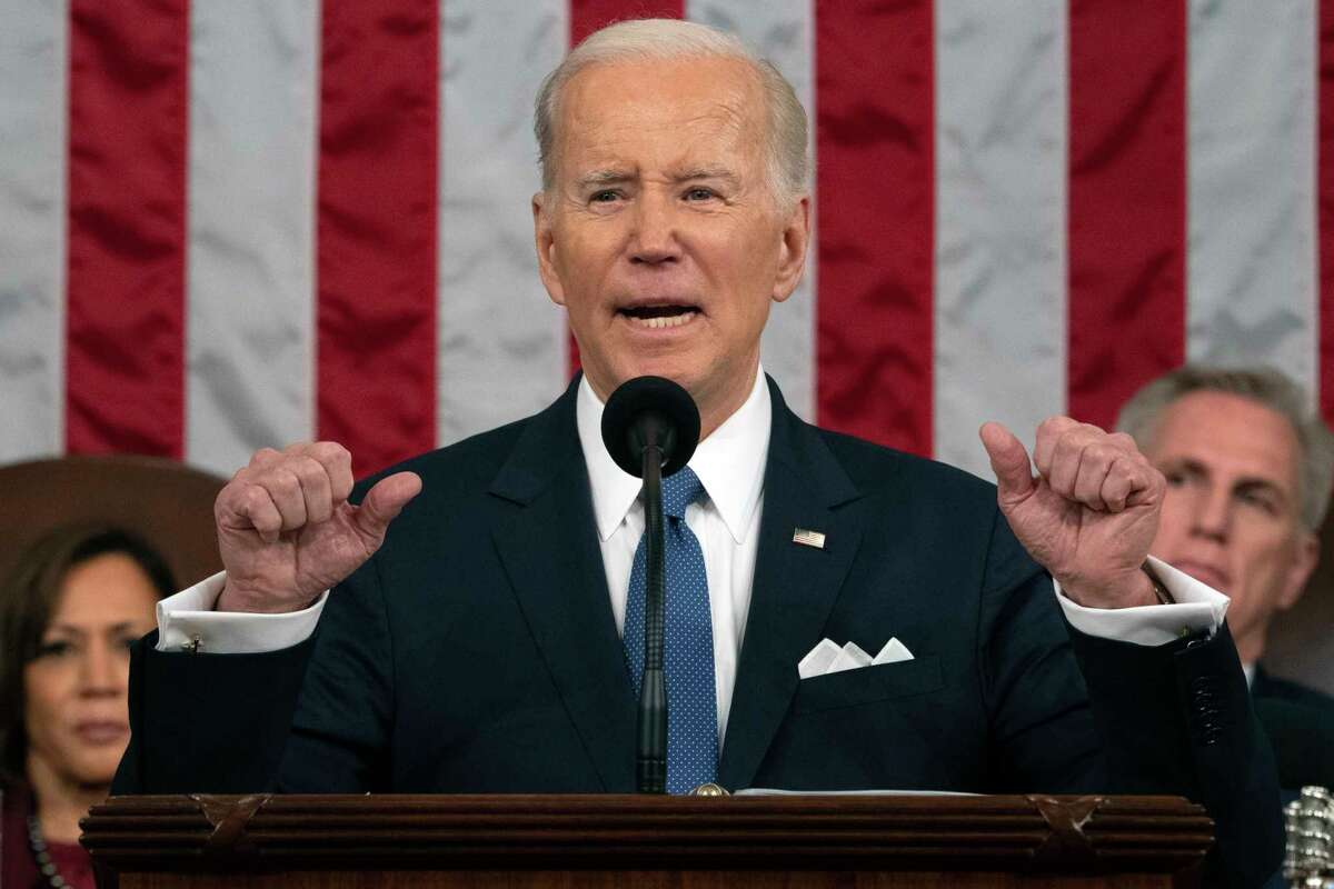FILE - President Joe Biden delivers the State of the Union address to a joint session of Congress at the U.S. Capitol, Feb. 7, 2023, in Washington, as Vice President Kamala Harris and House Speaker Kevin McCarthy of Calif., listen. Biden's upcoming budget proposal aims to trim deficits by nearly $3 trillion over the next decade. That's according to an administration official who insisted on anonymity to discuss the figures being released Thursday. The level of deficit reduction is significantly higher than the $2 trillion worth of deficit reduction that Biden had promised in his State of the Union address last month. (Jacquelyn Martin, Pool, File)
