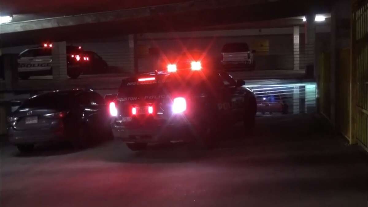 Police investigate a shooting in the parking garage at a south Houston complex.