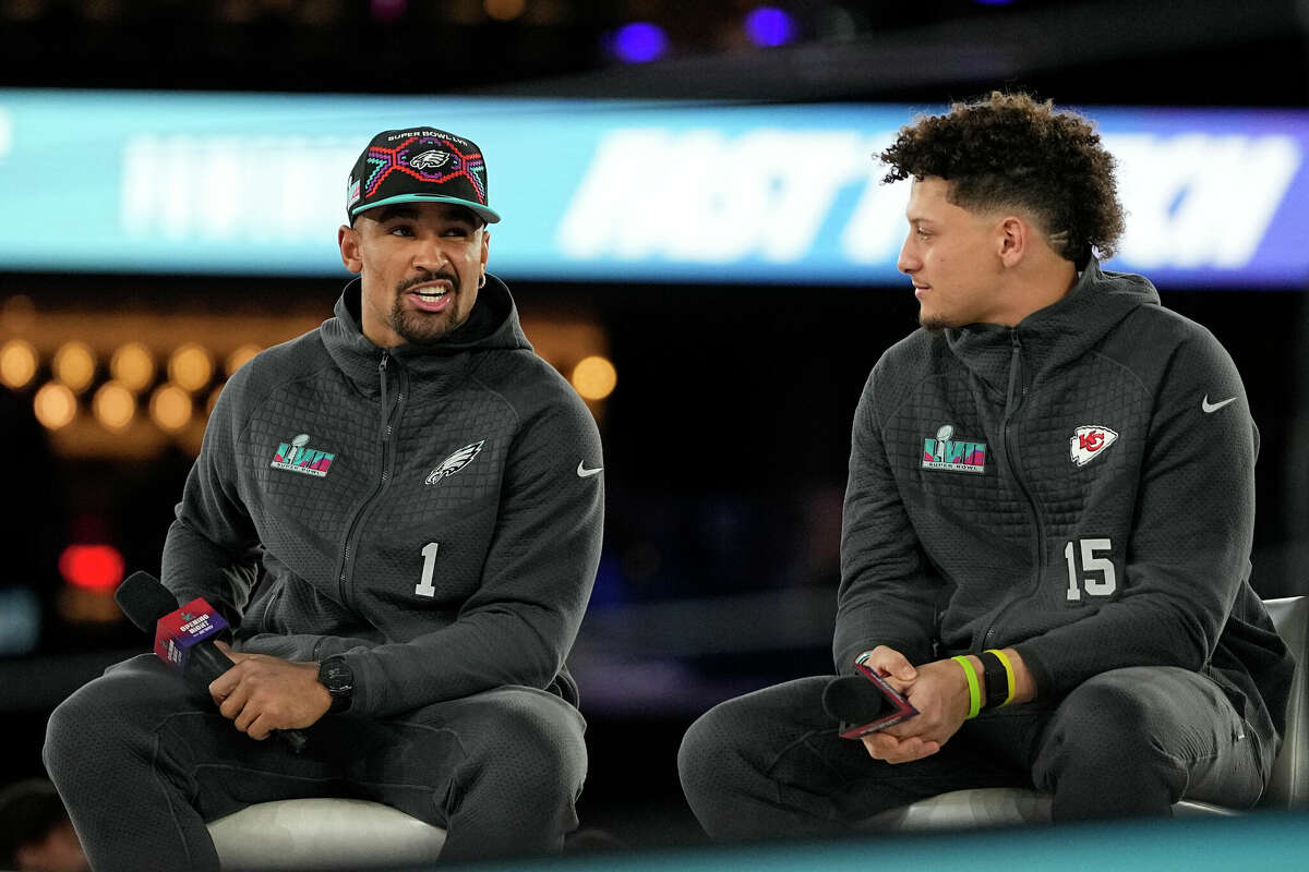 Philadelphia Eagles quarterback Jalen Hurts, a product of Channelview High School, and Kansas City Chiefs counterpart Patrick Mahomes address the media at Monday's opening night of Super Bowl 57 in Phoenix. 