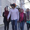 The six main subjects of the documentary "Hudson, America," walk down Warren Street in the city of Hudson.