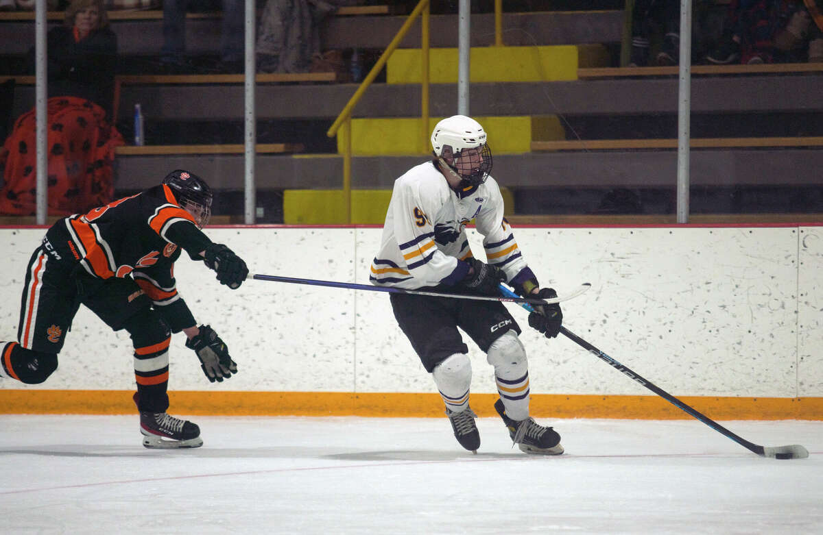 Bethalto's Ty Ferguson (90), right, suffered a shoulder injury in Monday's playoff loss to Triad and will be out for Tuesday's Game 2 of the best-of-three Class 1A MVCHA semifinal series. He is shown in action last week in the Eagles' opening series win over Edwardsville.  