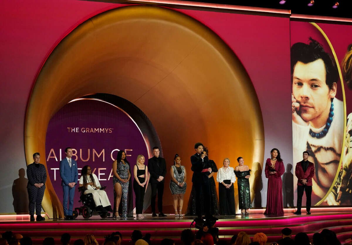 Super fans and Host Trevor Noah, front, present the award for album of year at the 65th annual Grammy Awards on Sunday, Feb. 5, 2023, in Los Angeles. Stamford native Joey Macari, fifth from left, served as a representative of fans of Coldplay, whose album "Music of the Spheres" was nominated.