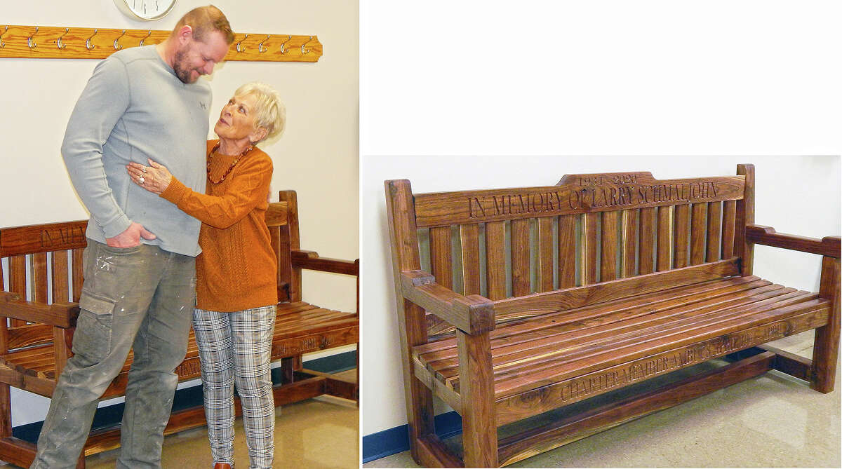 At left, Shawn Lovekamp gets a hug from Doris Schmaljohn during the dedication of a bench (below) in memory of her late husband, Larry R. Schmaljohn, at Pathway Services Unlimited. Lovekamp built the bench at the request of Ambucs of Jacksonville. Larry Schmaljohn was a charter member of Jacksonville's Ambucs chapter when it formed in 1964 to provide support for Pathway and remained active in the club until his death in April 2020. Ambucs members had their weekly luncheon meeting at Pathway and spent the time sharing memories of Larry Schmaljohn.