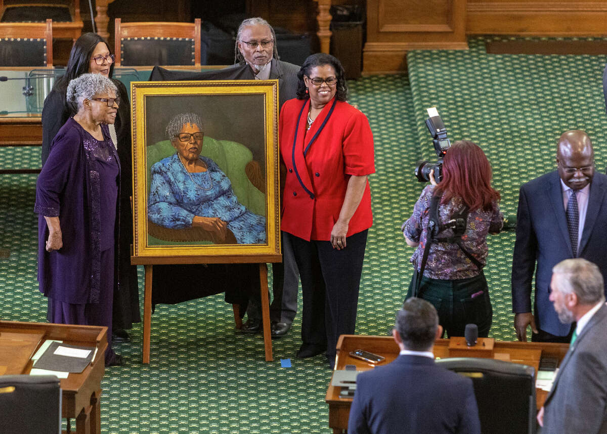 Opal Lee, left, poses for pictures Wednesday, Feb. 8, 2023, next to the painting of herself that will permanently hang in the Texas Senate chambers. The "Grandmother of Juneteenth," Lee was the primary catalyst behind Juneteenth becoming a national holiday. Her painting will be only the second painting of a Black woman to hang in the Senate.