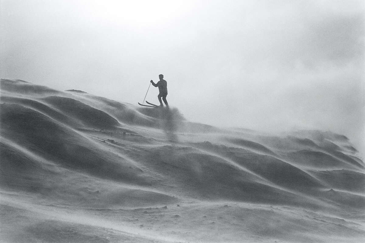 View of an unidentified skier on Mt Disney (formerly Hemlock Peak) at the Sugar Bowl Ski Resort.