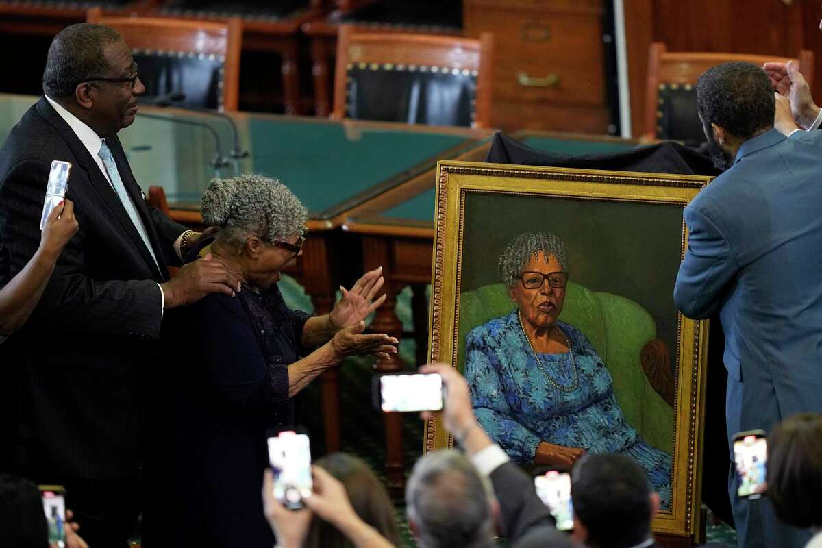 Opal Lee, who worked to help make Juneteenth a federally-recognized holiday, second from left, stands with state Sen. Royce West, left, as her portrait is unveiled in the Texas Senate Chamber, Wednesday, Feb. 8, 2023, in Austin, Texas.