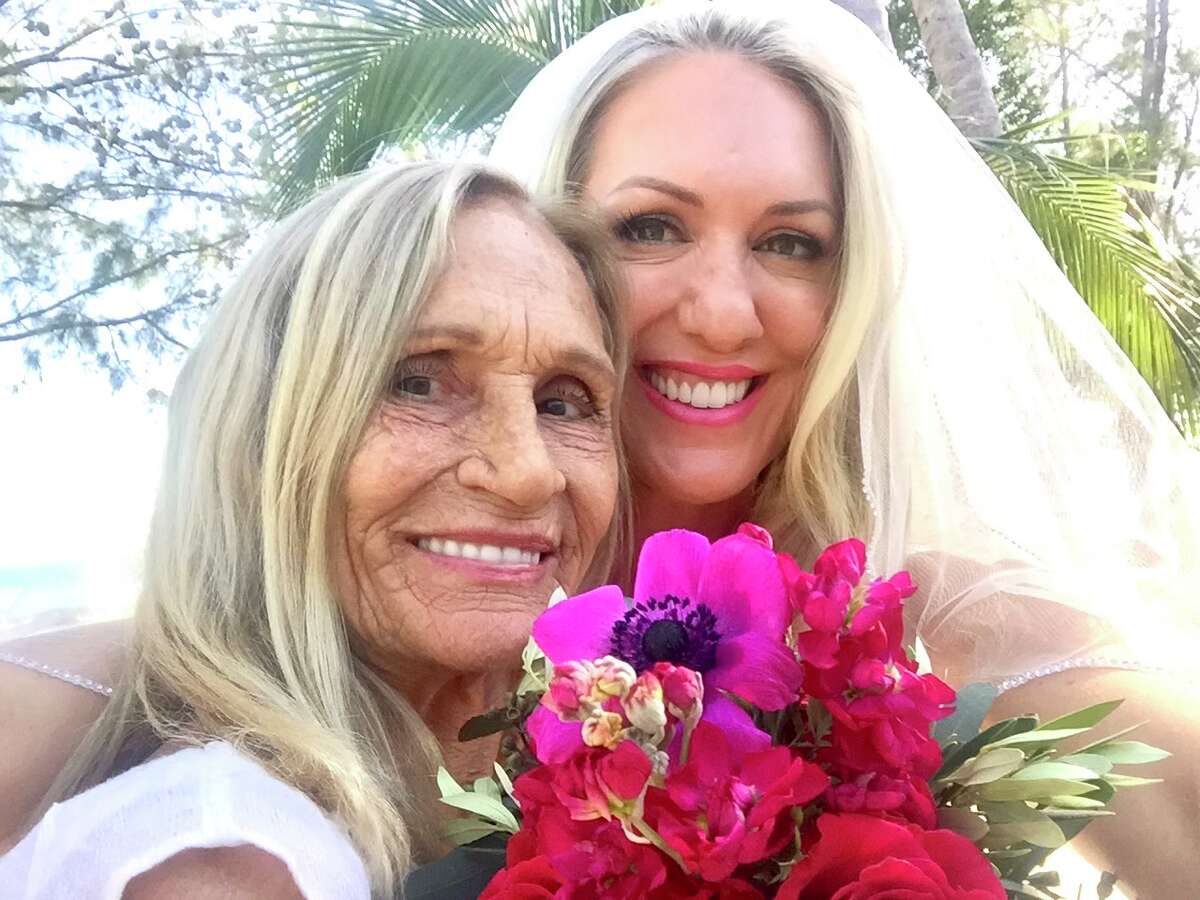 Rita Grant stands with her daughter Faith Grant Zini at Zini’s wedding in Florida in 2018. Grant was homeless in 2003 in San Francisco when her sister and another daughter flew out from Florida and took her home, where Grant regained stability and lived a healthy life until dying of cancer in January 2023.