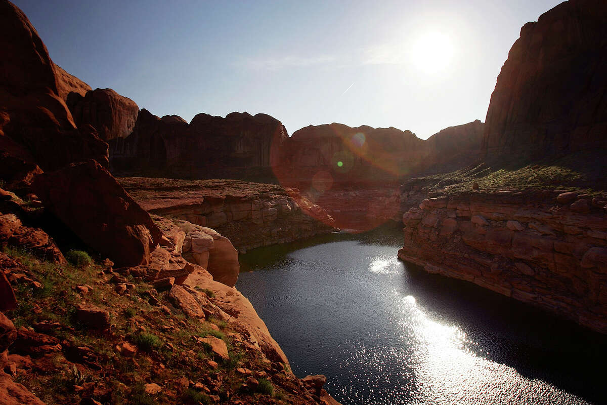 relationship The sun rises over the low lake level, the result of a six-year drought that dramatically dropped the level of the reservoir, in Llewellyn Gulch canyon on March 28, 2007, near Page, Ariz. Lake Powell and the next biggest Colorado River reservoir, the nearly 100-year-old Lake Mead, are at the lowest levels ever recorded.