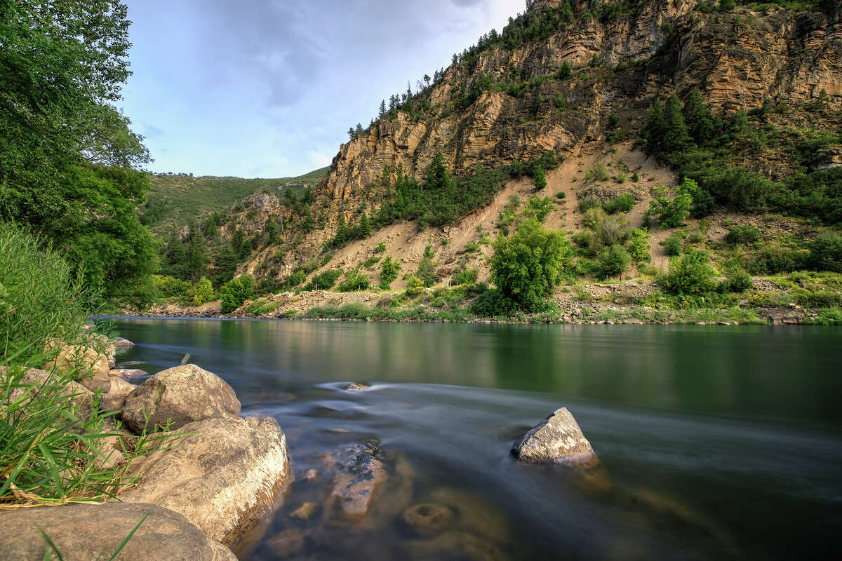 relationship The Colorado River flows through Glenwood Canyon, Colo.