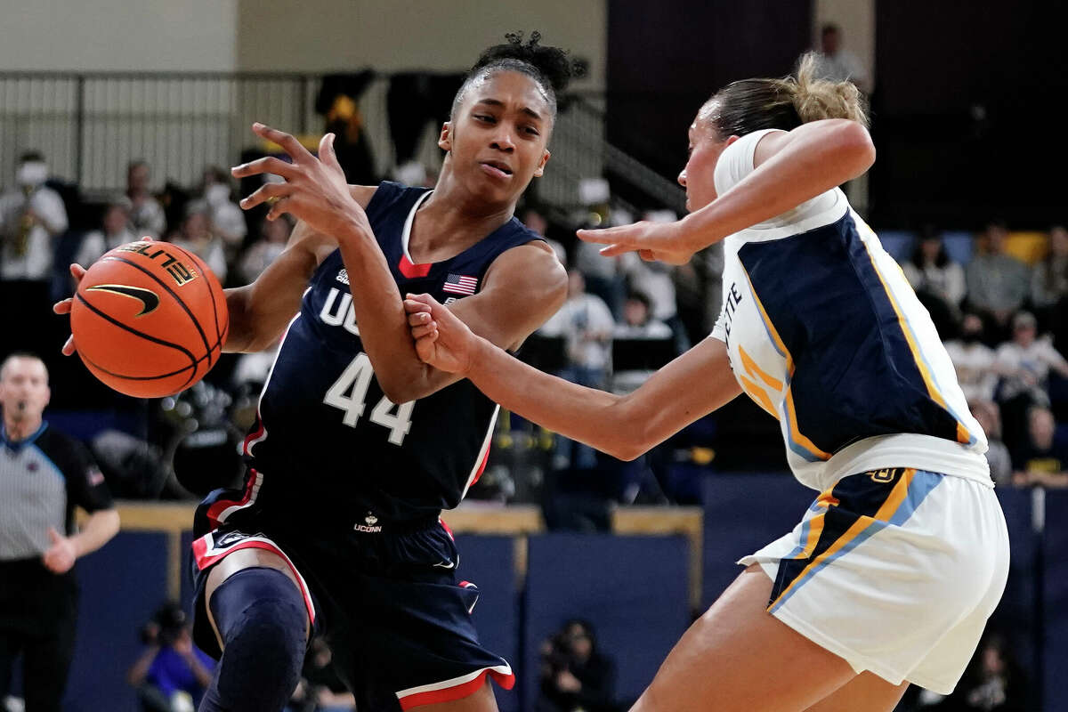 UConn's Aubrey Griffin (44) drives to the basket against Marquette's Emily La Chapell during the first half of an NCAA college basketball game Wednesday, Feb. 8, 2023, in Milwaukee. (AP Photo/Aaron Gash)