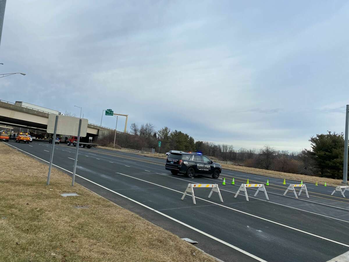 Windsor police and state police responded after a car went off I-91 in Windsor Thursday morning and was left hanging over the Poquonock Avenue overpass.