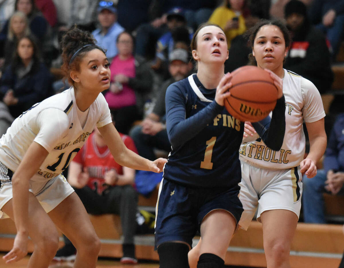 Father McGivney's Mary Harkins drives to the basket against Althoff in a non-conference game on Wednesday in Belleville