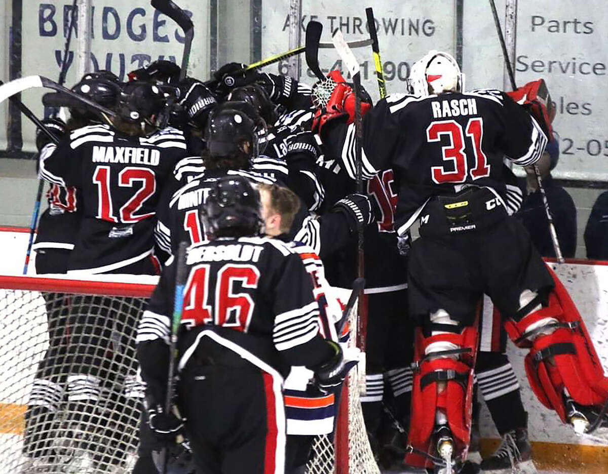 SIUE players celebrate a recent win. The Cougars will begin MACHA Tournament play at 8:45 p.m. Friday against the University of Illinois at the Maryville University Hockey Center.