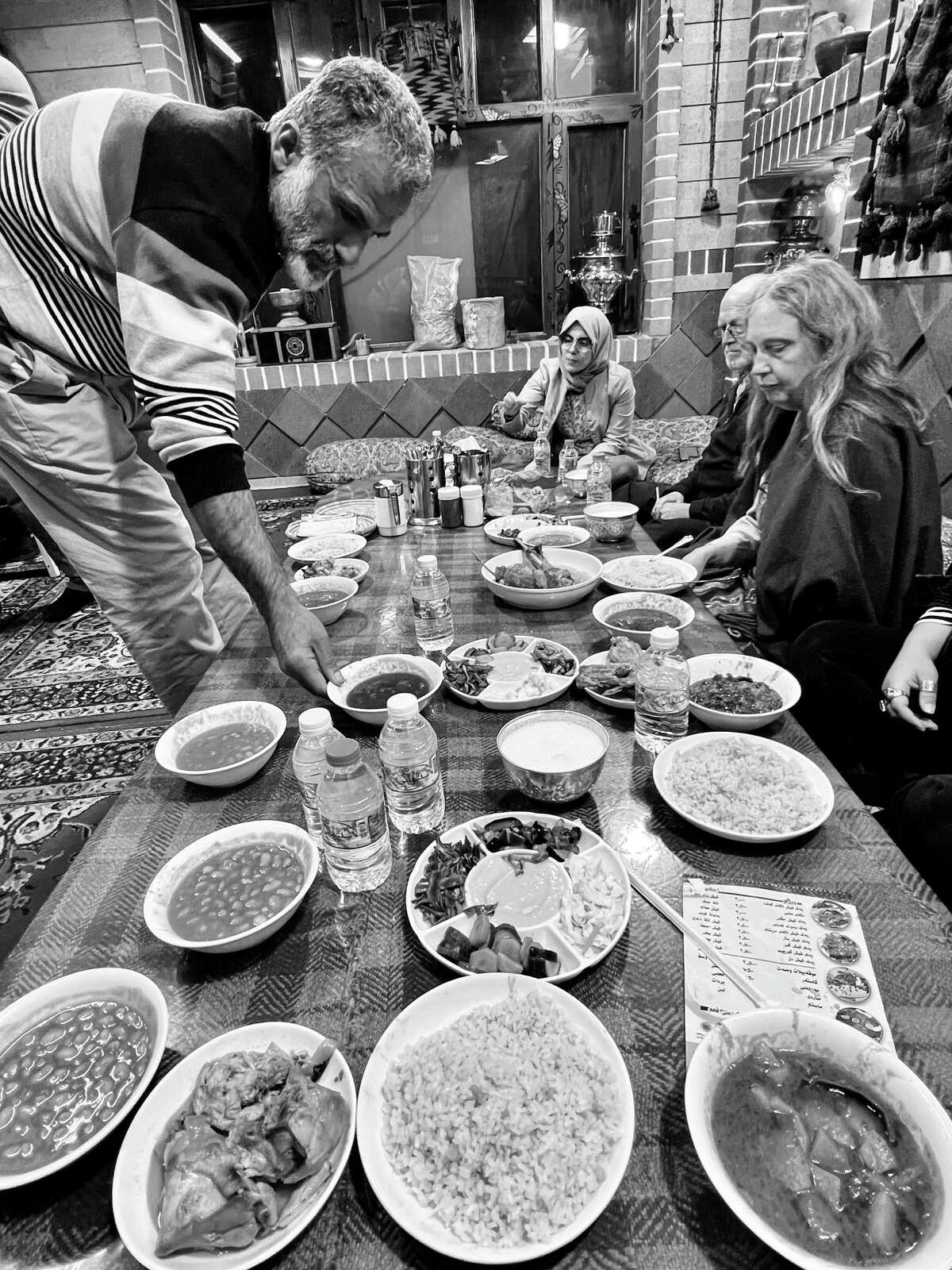 Yassin lays out a spread of food, Kurdish style, for the Capital Region supporters who visited him in Kurdistan in January 2023.