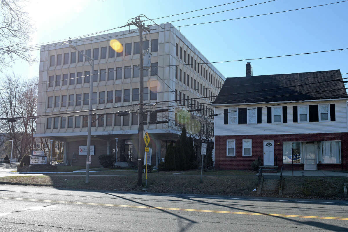 The owner of a Danbury office building wants to convert the five-story structure into 48 apartments and build a 160-unit apartment building in the parking lot behind it, with a three-level parking garage. The 2.4-acre property at 30 and 34 Main St. is across the street from PriceRite. Photographed on Wednesday, February 1, 2023, in Danbury, Conn.