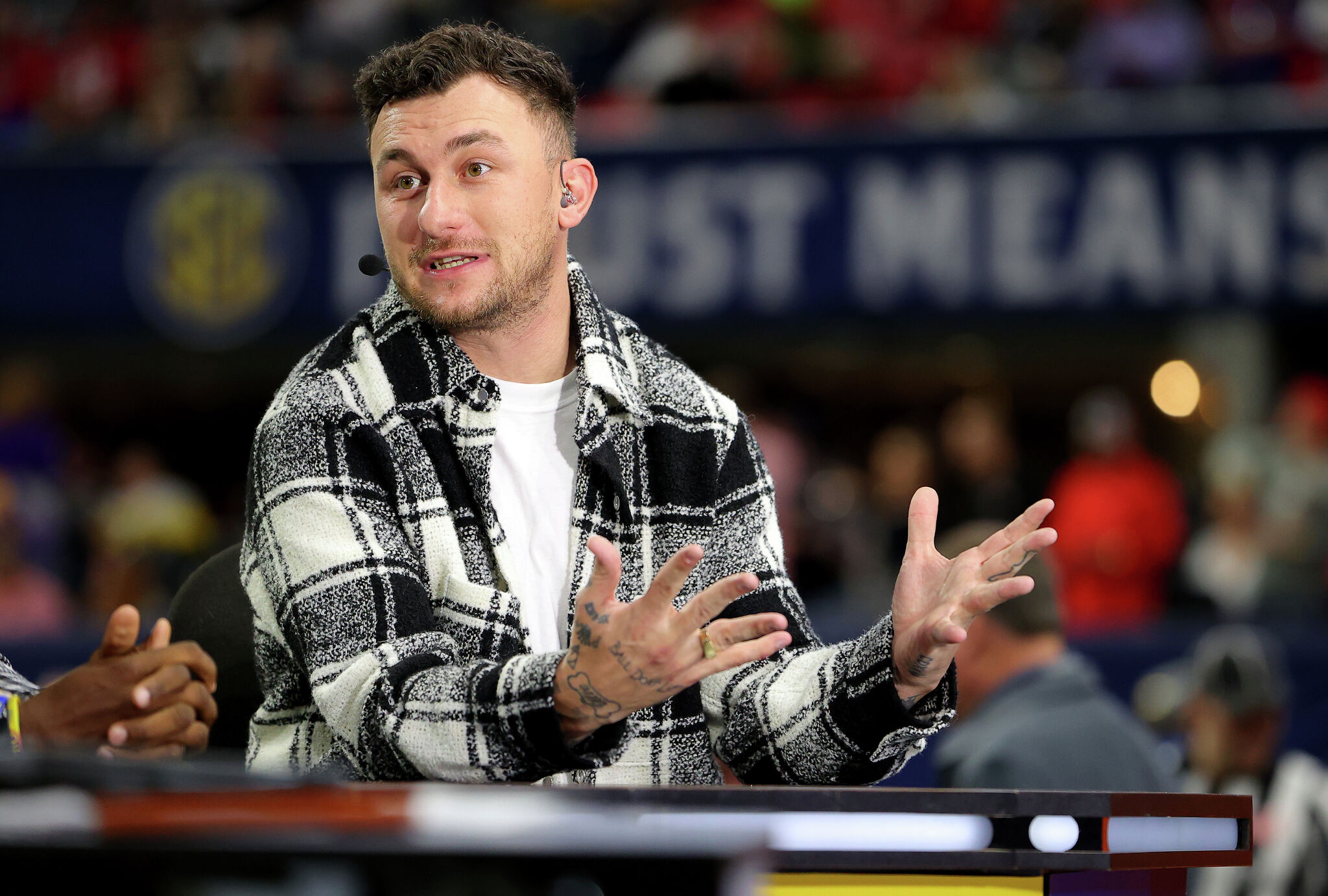Heisman Trophy winning quarterback Johnny Manziel throws out the News  Photo - Getty Images