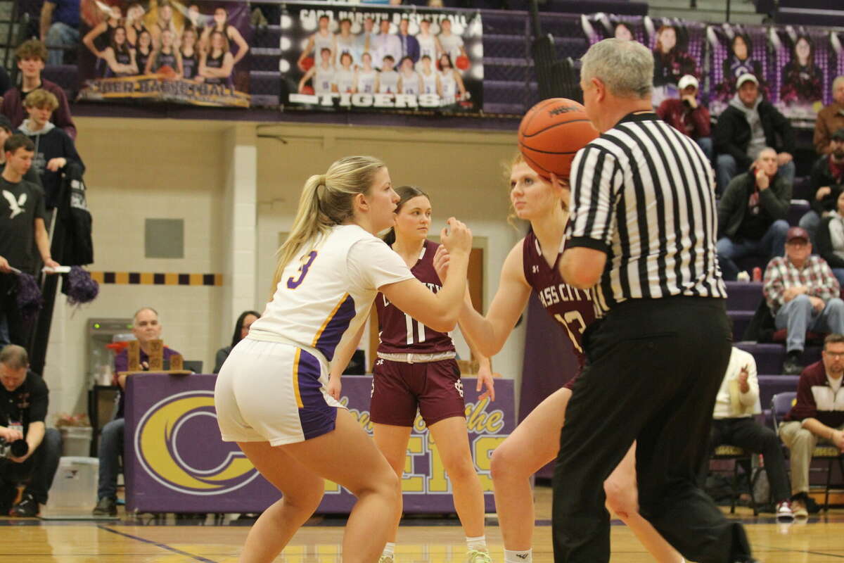 The opening tip-off between Cass City's Shelby Ignash and Caro's Adelyn Moore.
