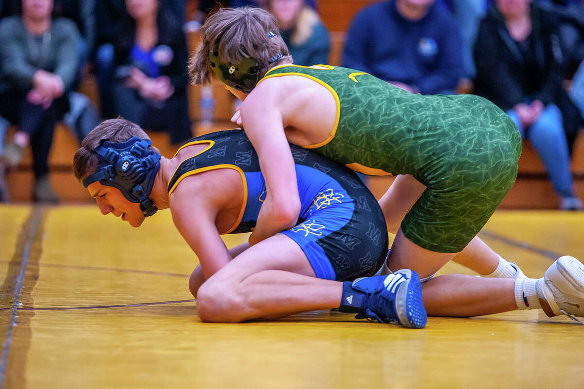 PHOTOS Dow and Midland high take part in wrestling district tournamen