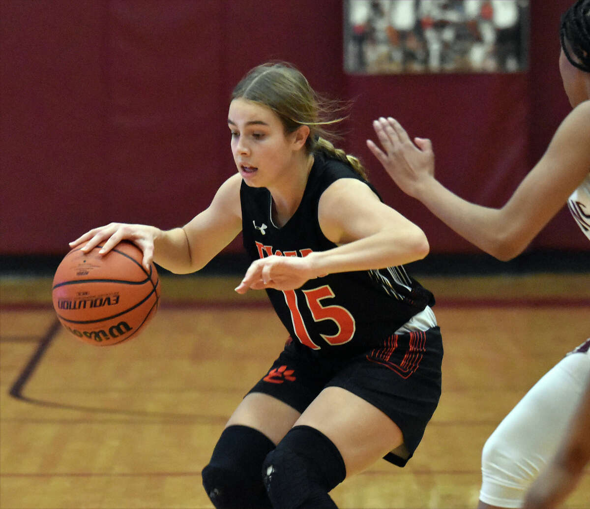 Edwardsville's Blakely Hockett dribbles at the top of the key against Belleville West on Thursday in Southwestern Conference action in Belleville.