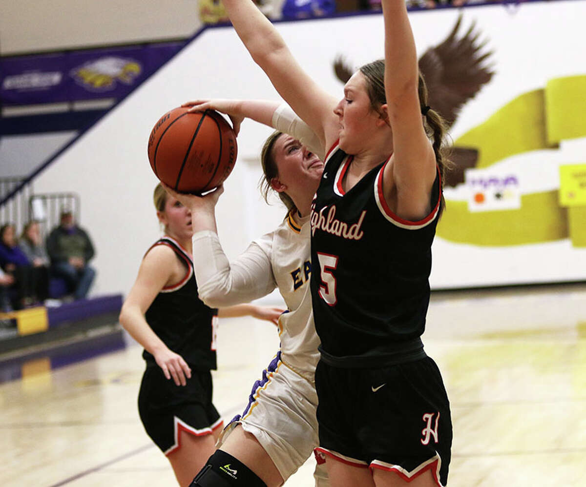 CM's Olivia Durbin tries to shoot over Highland's Abby Schultz (5) on Monday night in a MVC girls basketball game in Bethalto.