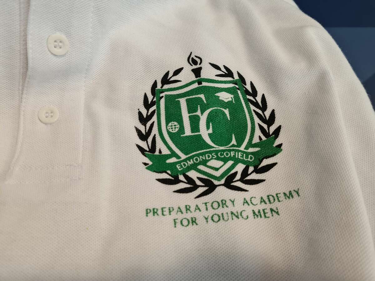 A shirt with a logo of proposed Edmonds Cofield Preparatory Academy for Young Men.
