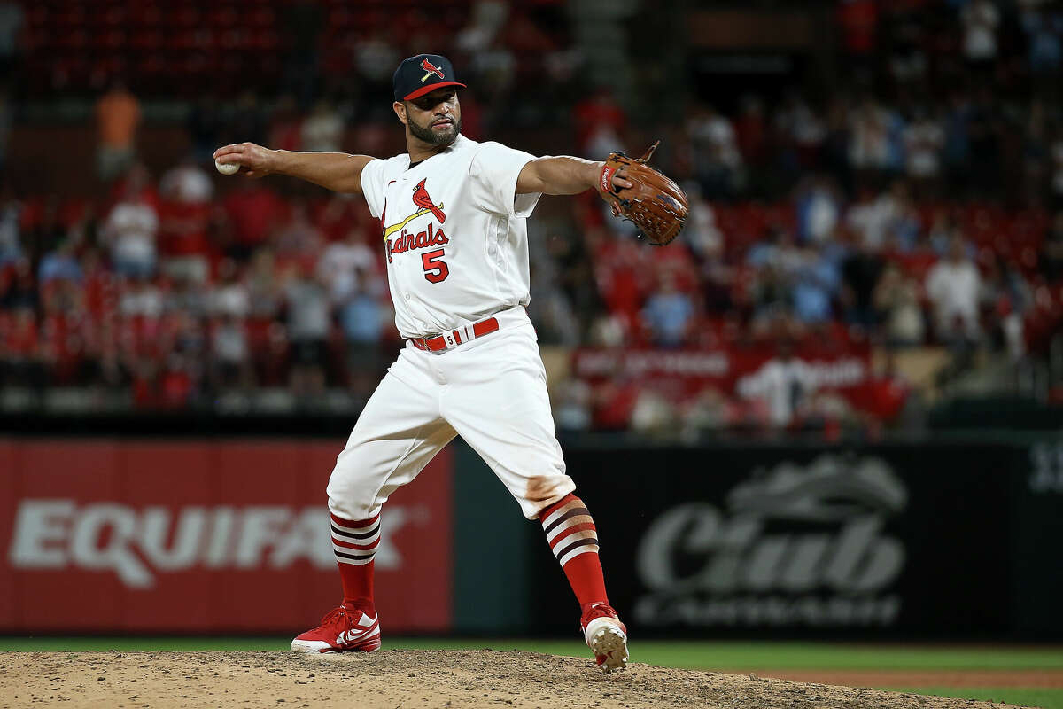 ST. LOUIS, MO - MAY 15: Albert Pujols #5 of the St. Louis Cardinals pitches during the ninth inning against the San Francisco Giants at Busch Stadium on May 15, 2022 in St. Louis, Missouri. (Photo by Scott Kane/Getty Images)