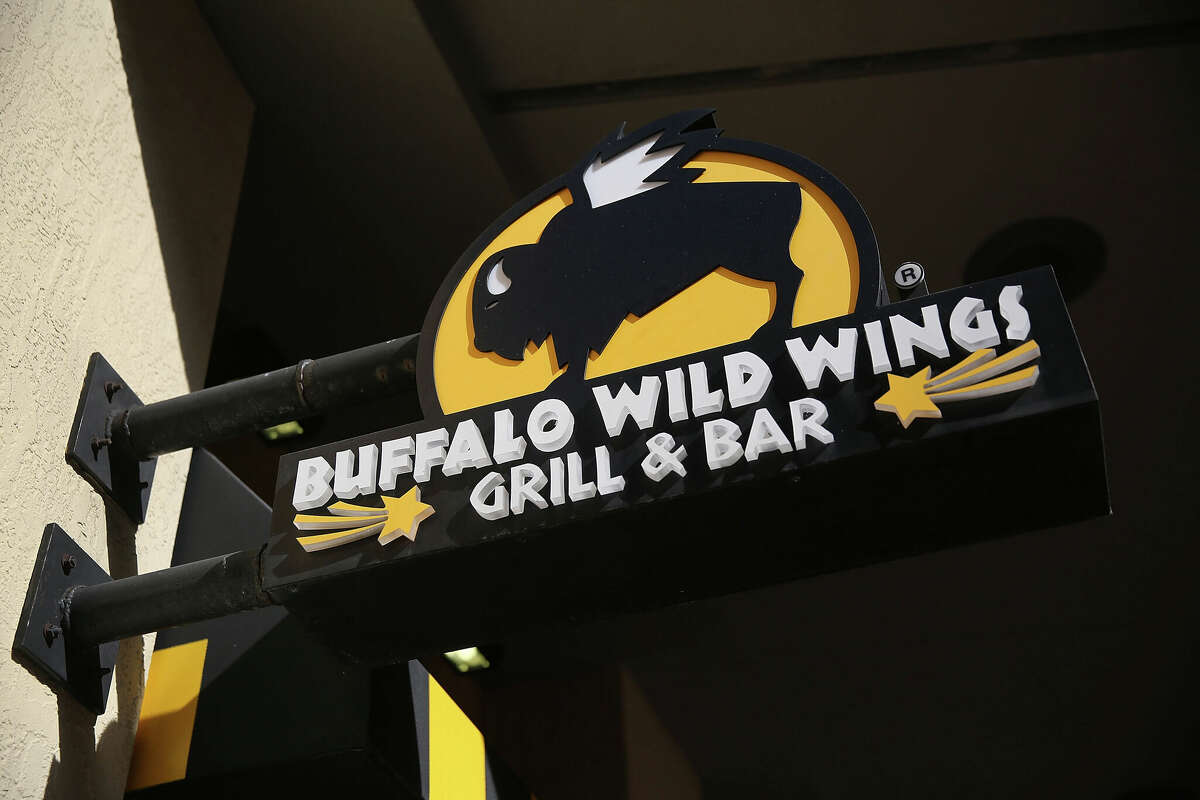 MIAMI, FL - NOVEMBER 28: A sign is seen on a Buffalo Wild Wings restaurant on November 28, 2017 in Miami, Florida. Today, Arby's Restaurant Group announced it reached a deal to acquire Buffalo Wild Wings for $2.4 billion in cash. (Photo by Joe Raedle/Getty Images)